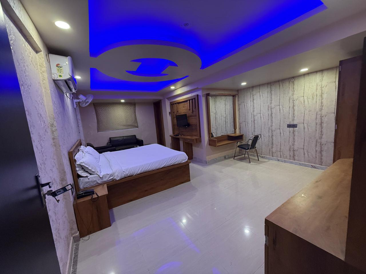 Deluxe Room with king bed and modern lighting